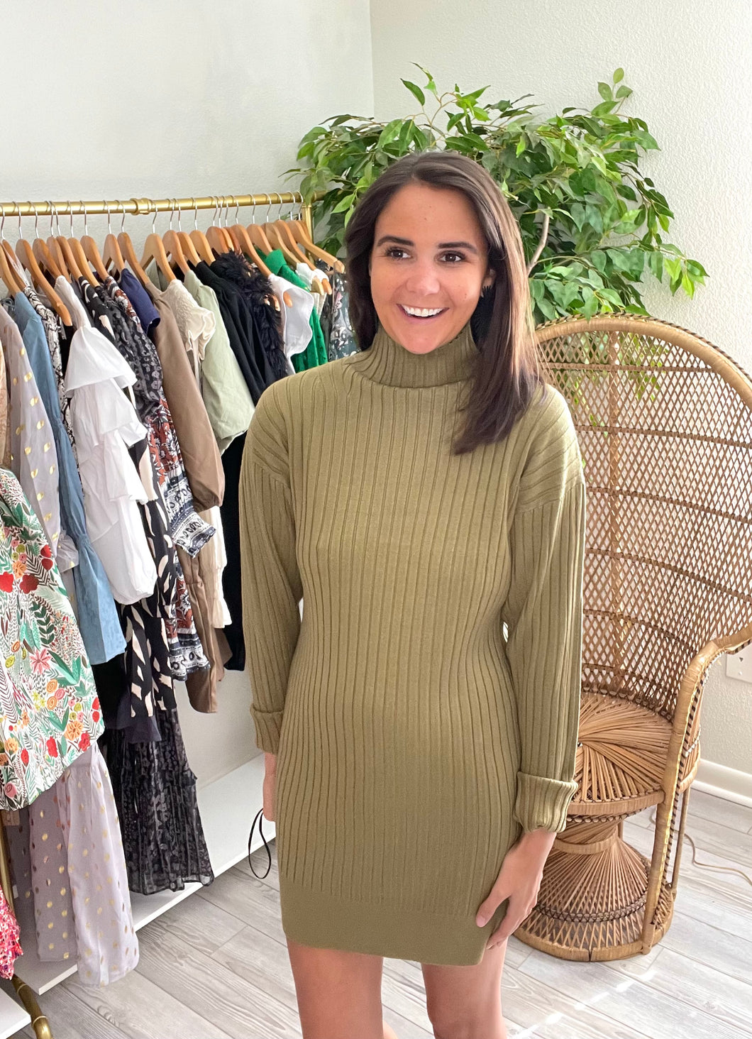 Olive sweater dress, ribbed and fitted.  True to size, wearing size small.