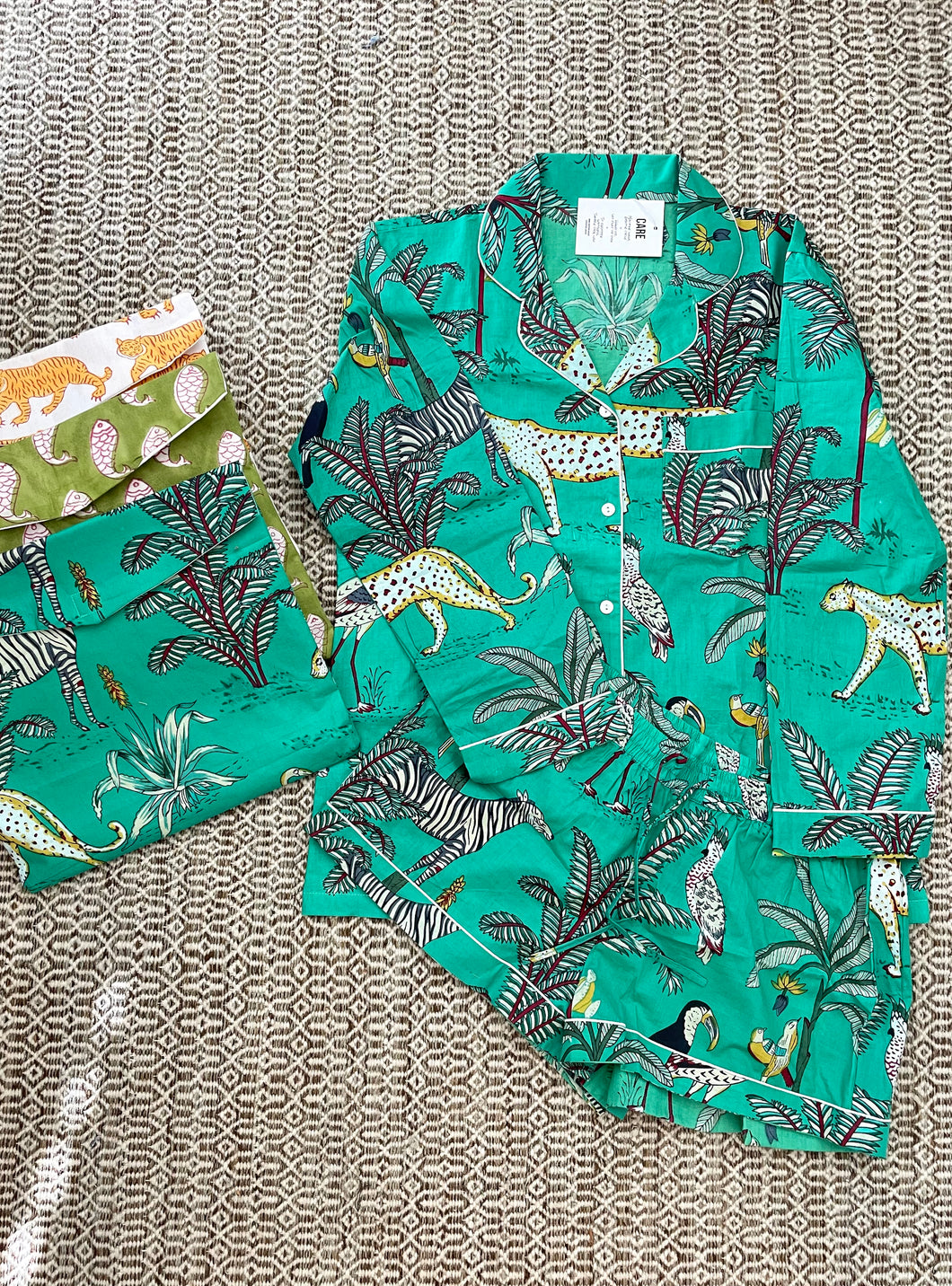 Pajama set with elastic shorts and button down long sleeve blouse. Extremely light weight cotton. Matching envelope packaging for gifting or to use as a dirty clothes bag while traveling.  Fits roomy, wearing size XS/S.  Machine washable, line dry.
