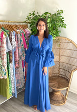 Load image into Gallery viewer, Royal blue maxi dress with pockets, exaggerated sleeves, elastic waist with adjustable drawstring tie at waist. Polyester silk blend.  True to size, wearing size small.  Good for bump, post bump or no bump!
