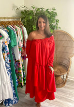 Load image into Gallery viewer, Red off shoulder ankle dress with ruffle detailing and asymmetrical layered front skirt. Poly silk and cotton blend.  True to size, meant to fit roomy, wearing size small.  Good for bump, post bump or no bump!
