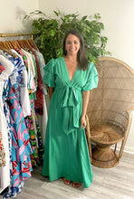 Load image into Gallery viewer, Kelly green maxi dress with pockets, exaggerated puff sleeves, elastic waist with adjustable drawstring tie at waist. Polyester silk blend.  Fits roomy, wearing size small.  Good for bump, post bump or no bump!
