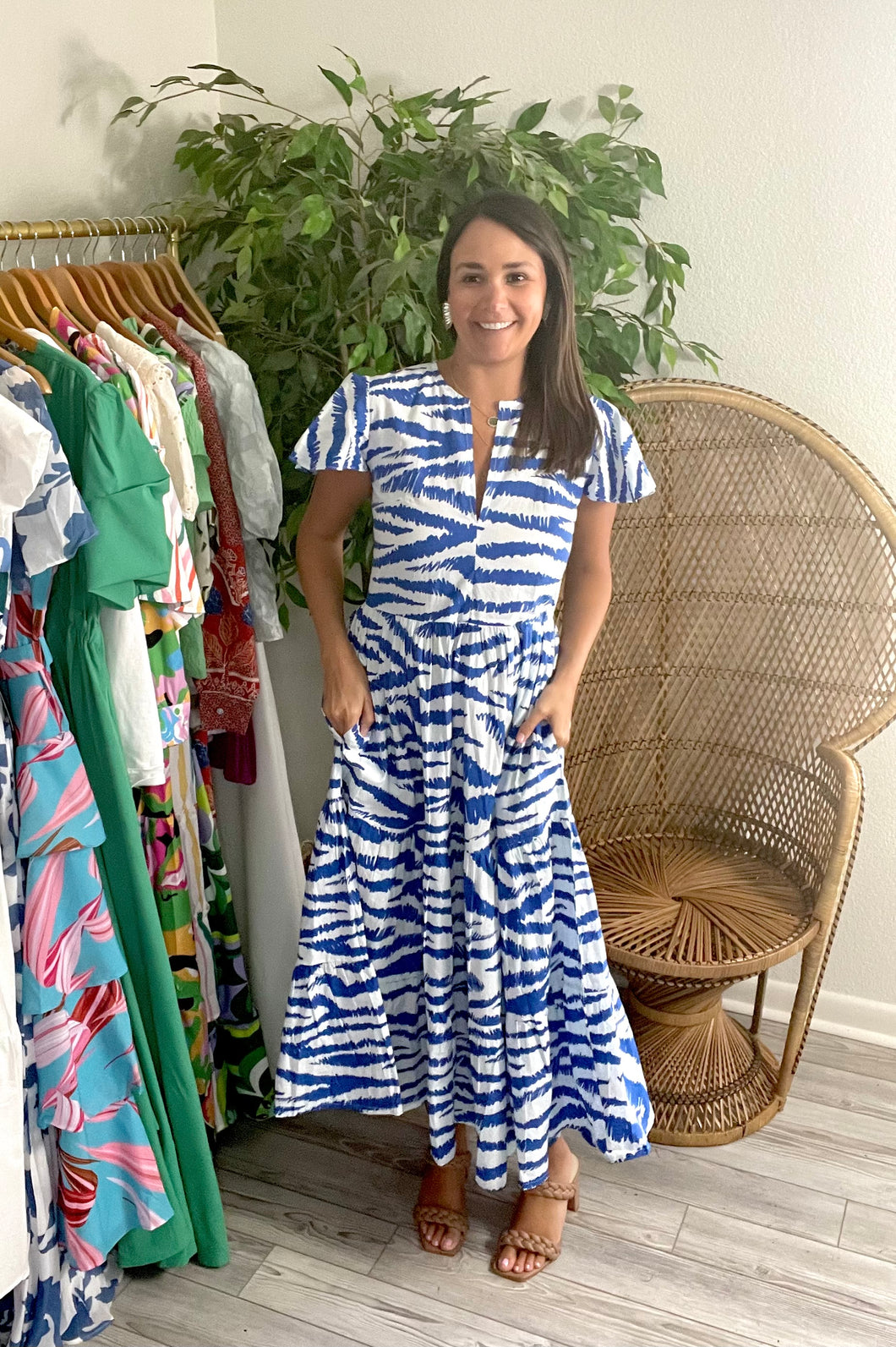 Blue and white singita print ankle dress. Flutter sleeves and tiered skirt with pockets. Light weight cotton.   If bustier, size up, wearing size x-small.  Good for bump, post bump or no bump!   