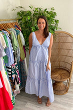 Load image into Gallery viewer, Blue and white thin striped maxi dress. Button front and tiered ruffle detailing throughout skirt. Fashion tape NOT needed. Back mirrors frontside. Poly silk blend.   True to size, wearing size small.  Good for bump, post bump or no bump!  Could be worn as a coverup
