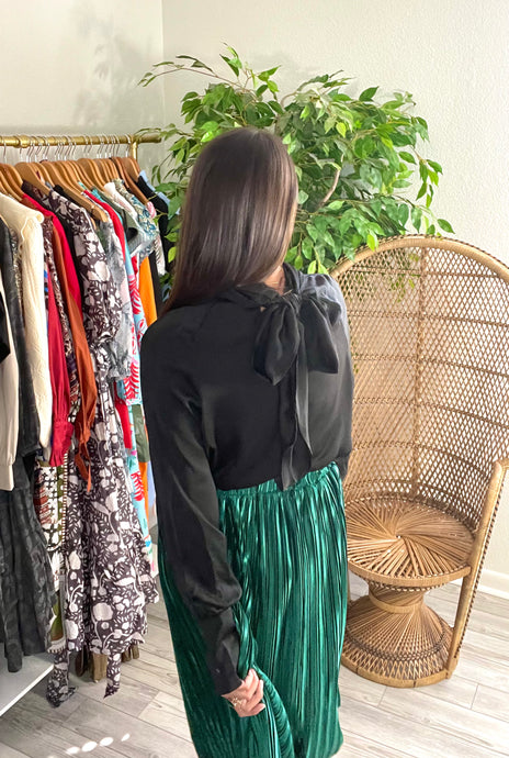 Cross wrap front tie back blouse + Cross over wrap neckline + Tie back detail + Long sleeves with buttoned cuffs. Front key hole, suggest safety pin. Silk.  True to size, wearing size small.