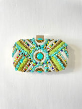 Load image into Gallery viewer, Beaded and sequined clutch with gold edging and turquoise knobs. Backside gold fabric. Removable gold chain strap.   
