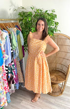 Load image into Gallery viewer, Orange floral tank dress with ruched straps and square neckline. Gauze cotton blend with high low hemline.  Fits roomy, wearing size small.  Good for bump, post bump or no bump!
