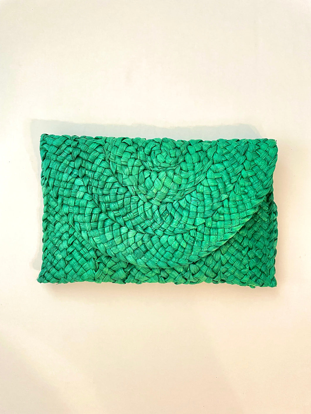 Emerald woven straw clutch. Metal clasp button closure.  9.84 x 6.69 inches. Iphone fits with room.