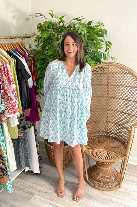 The Lily Mae long sleeve mini dress. Drop pleated sleeves, tiered dress throughout with ruffle detailing. Optional front tie closure. Light weight and lined.  True to size, wearing size x-small. 5'5 height, size up for length if needed.