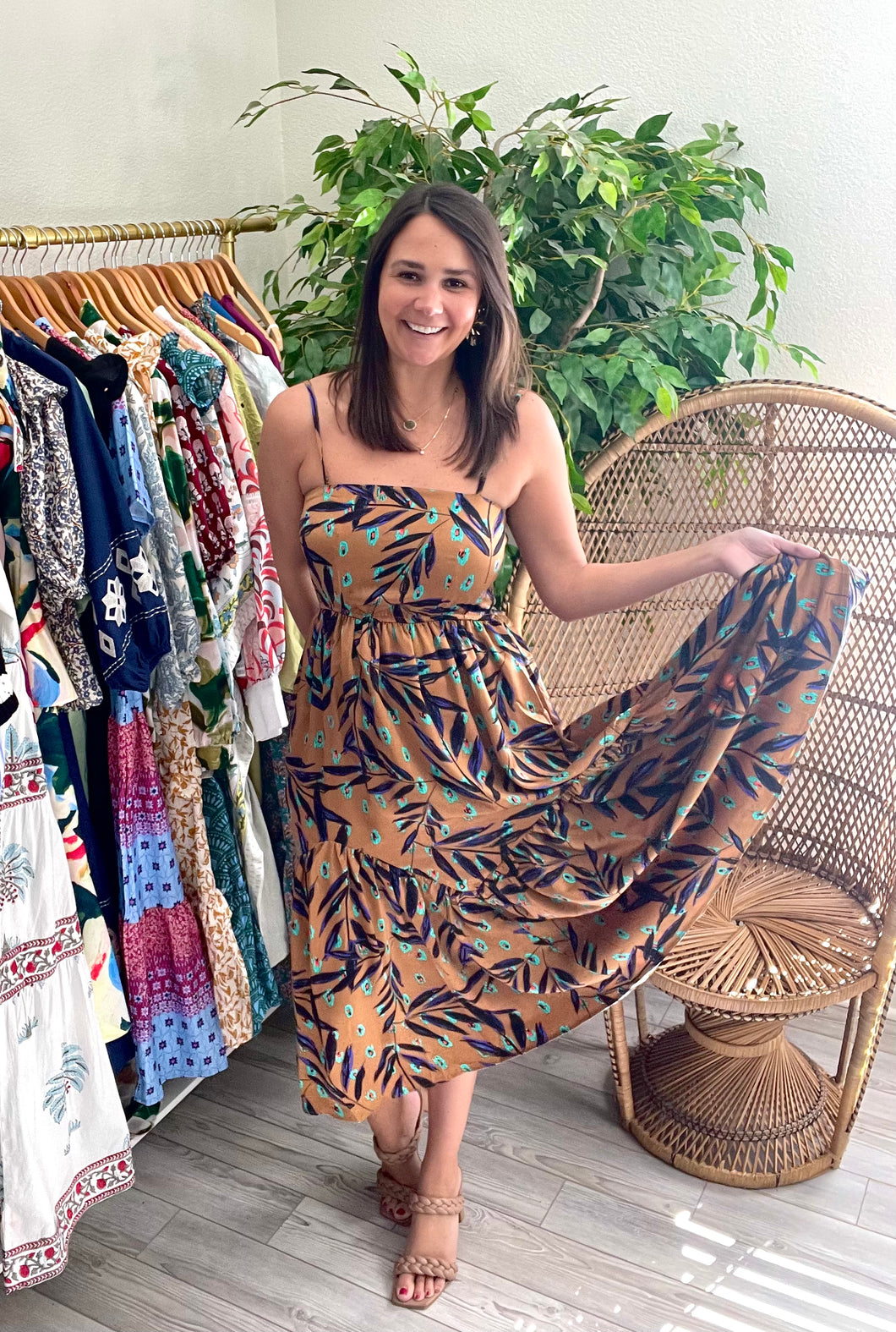 Silk ankle dress with tiered skirt with a modern peacock feather print. Pockets, adjustable straps and smocked backside for adjustable fit.  Size up for chest, wearing size small.  Good for bump, post bump or no bump!