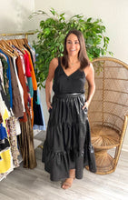 Load image into Gallery viewer, Black faux leather ankle skirt. Tiered, empire waist and pockets. Backside of band is elastic.   True to size, wearing size x-small.
