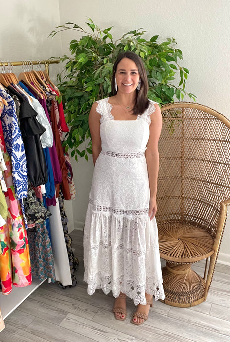 White eyelet ankle dress with detailed straps as well as detailed lace tiered layers throughout. Back zipper closure, lined, cotton.  True to size, wearing size small.