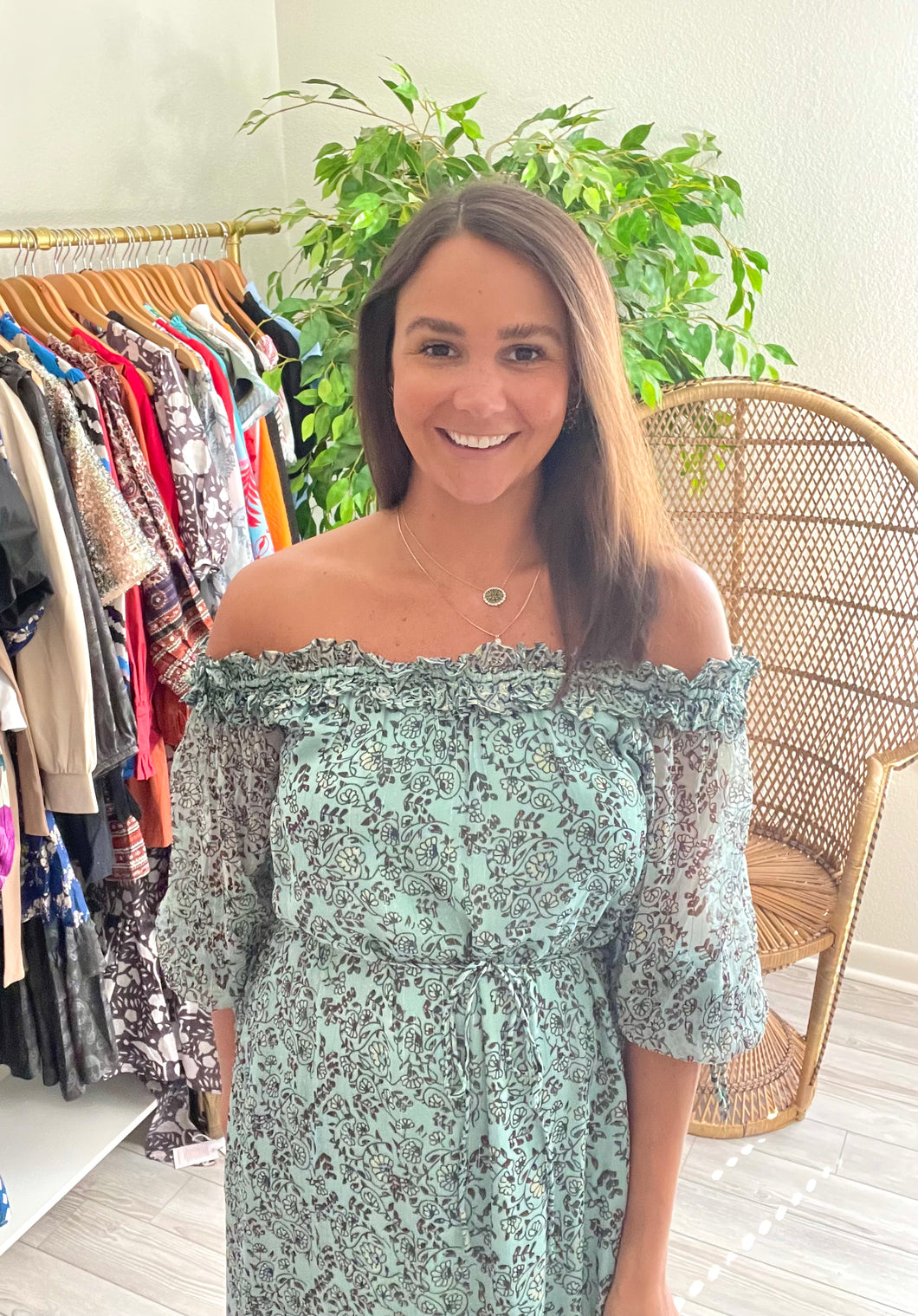 Iris floral print ankle dress. Elastic off-the shoulder with ruffles, sheer sleeves with ties at wrist. Removable tie at waist. Straight dress with drop ruffle hemline. Silk double lined with gold foiling throughout fabric.  True to size, wearing size x-small.  Good for bump, post bump or no bump!