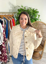 Load image into Gallery viewer, Ecru cropped quilted jacket with ruffle squared collar. Horn buttons and optional front tie closure.  True to size, wearing size small.
