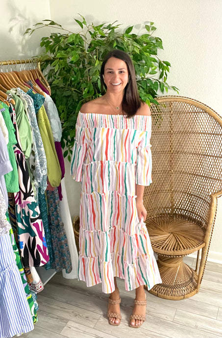 Smocked off shoulder midi dress with striped multi colored pattern. Tiered dress. Poly silk blend. Can be worn on or off the should.  Runs roomy, wearing size small.  Good for bump, post bump or no bump!